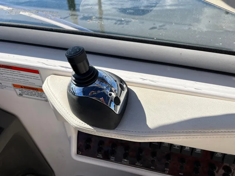 Slide: The Image of Joystick control on 2011 Regal 35 Express Cruiser dashboard. - 25