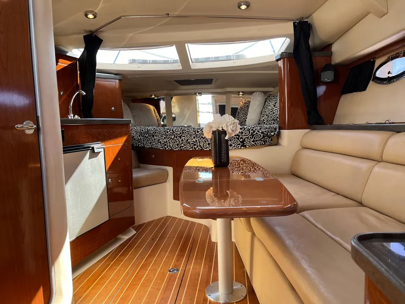 Slide: The Image of Luxurious interior of 2011 Regal 35 Express Cruiser with elegant seating and modern amenities. - 3