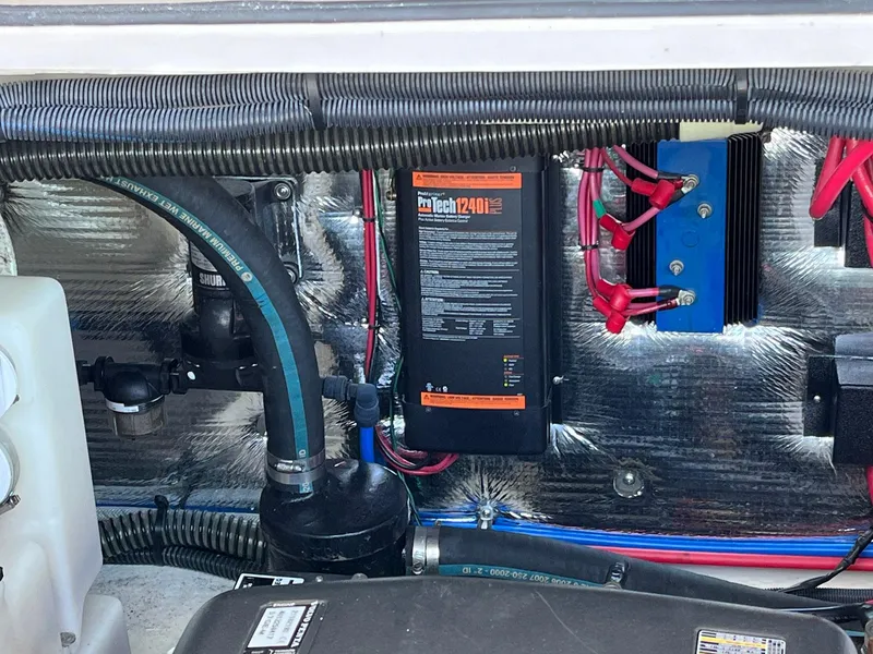 Slide: The Image of Engine compartment of a 2011 Regal 35 Express Cruiser with electrical components and wiring. - 37