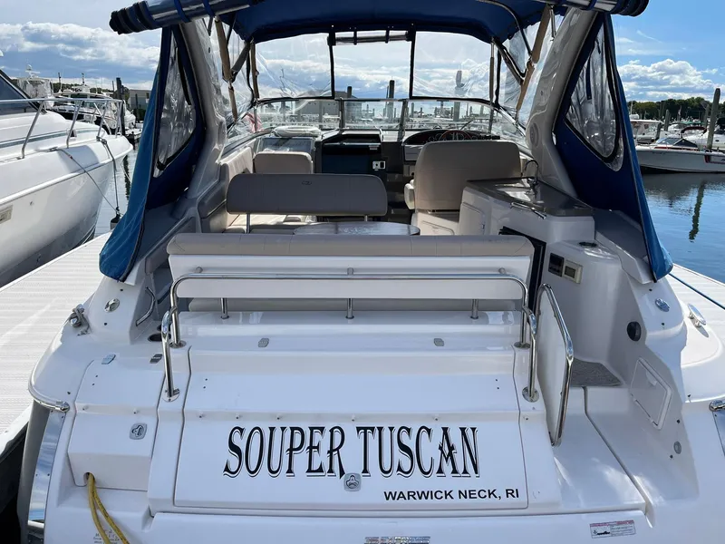 Slide: The Image of 2011 Regal 35 Express Cruiser docked, named "Souper Tuscan," at Warwick Neck, RI marina. - 40