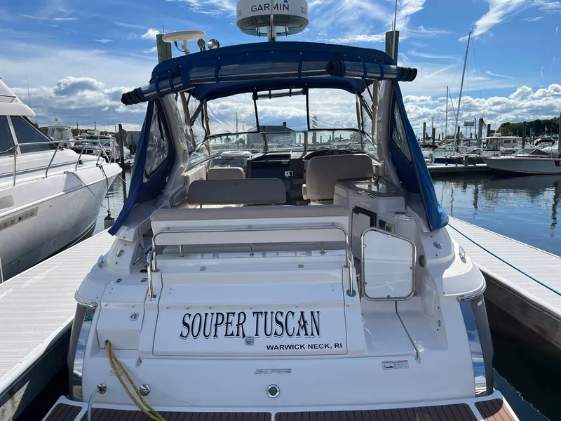 Slide: The Image of 2011 Regal 35 Express Cruiser docked at marina, named "Souper Tuscan." - 41
