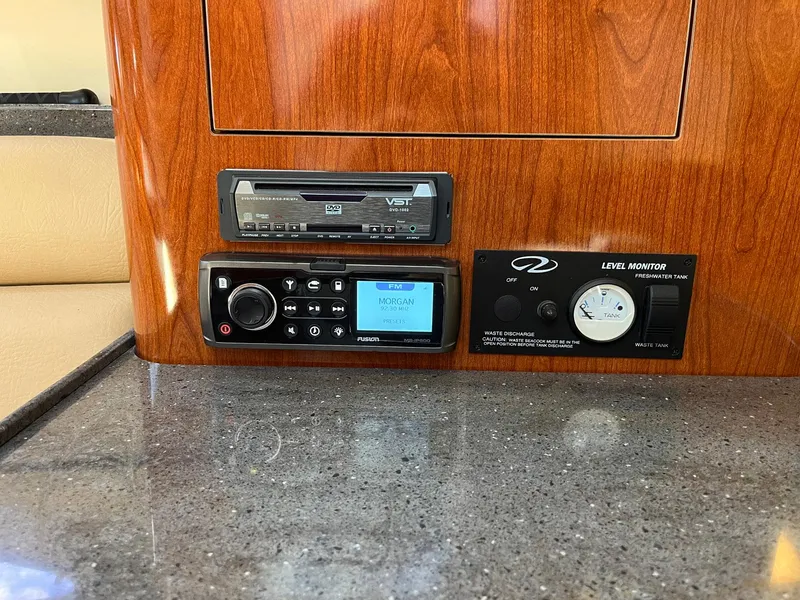 Slide: The Image of Control panel of 2011 Regal 35 Express Cruiser with audio system and level indicator. - 8