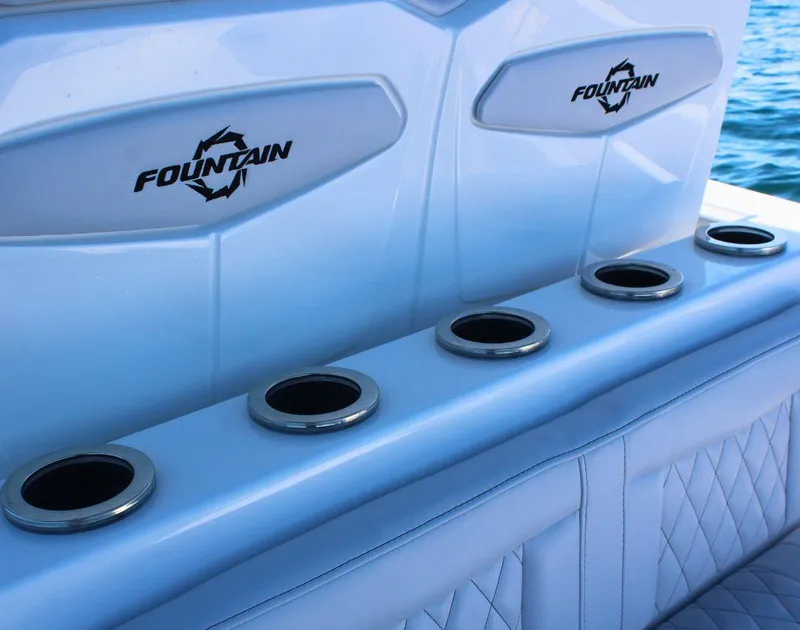 Slide: The Image of 2025 Fountain 34 CC boat interior with cup holders and logo detailing. - 10