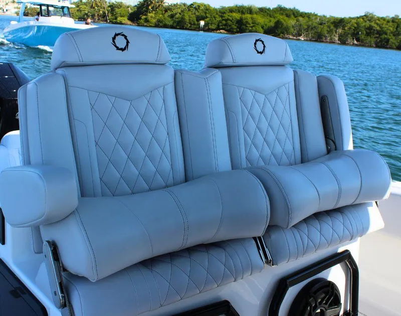 Slide: The Image of Luxury seating on 2025 Fountain 34 CC boat, featuring diamond-stitched upholstery. - 12