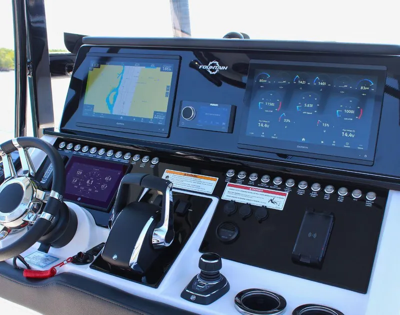 Slide: The Image of Control panel of 2025 Fountain 34 CC boat with advanced navigation and monitoring systems. - 13