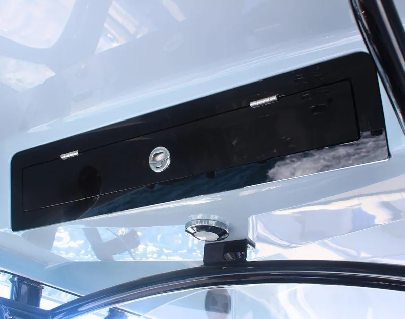 Slide: The Image of 2025 Fountain 34 CC boat interior detail with sleek black panel and modern design. - 15