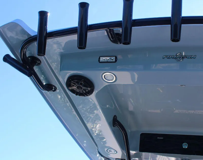 Slide: The Image of 2025 Fountain 34 CC boat, featuring rod holders and speakers on the deck. - 16