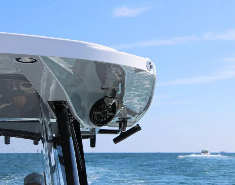 Slide: The Image of 2025 Fountain 34 CC boat on ocean, partial view, clear sky background. - 20