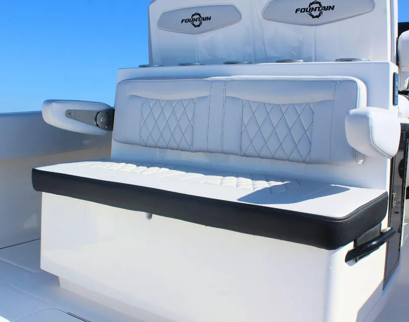 Slide: The Image of 2025 Fountain 34 CC boat seating with white upholstery and diamond stitching. - 9