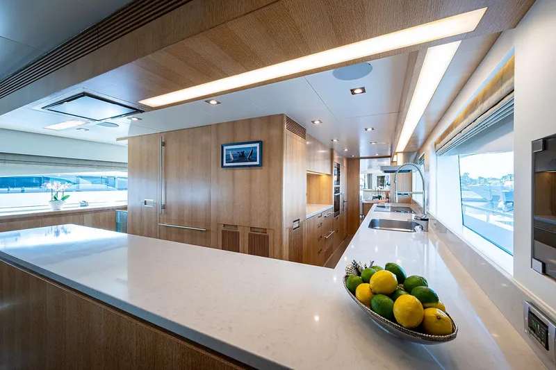 Slide: The Image of Luxurious kitchen interior on 2014 Horizon RP 110 yacht with modern design and fruit bowl. - 11