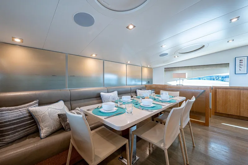 Slide: The Image of Luxurious dining area on 2014 Horizon RP 110 yacht with elegant table setting. - 13