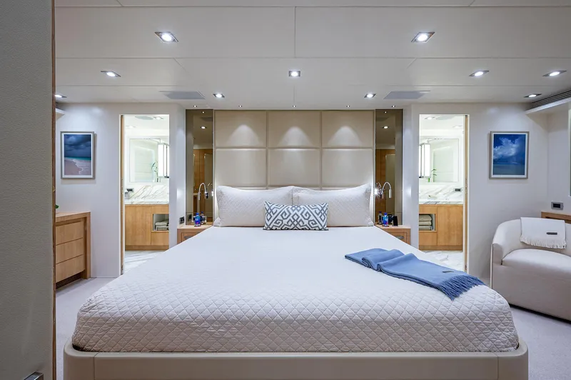 Slide: The Image of Luxurious bedroom interior on 2014 Horizon RP 110 yacht, featuring elegant decor and modern amenities. - 15