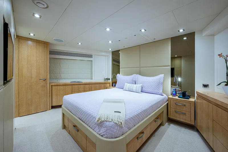 Slide: The Image of Luxurious bedroom interior on 2014 Horizon RP 110 yacht, featuring modern design and cozy ambiance. - 19