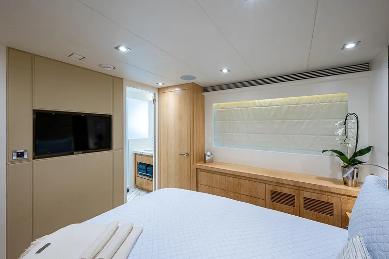 Slide: The Image of Luxurious bedroom interior of 2014 Horizon RP 110 yacht with modern decor and TV. - 22