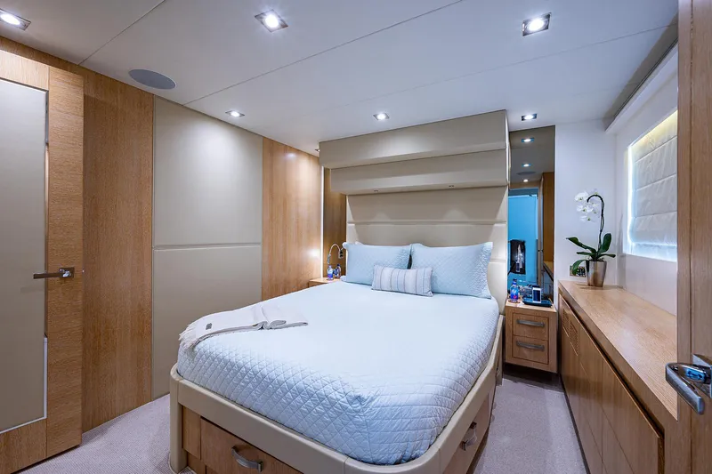 Slide: The Image of Luxurious bedroom interior in 2014 Horizon RP 110 yacht, featuring modern design and elegant furnishings. - 24