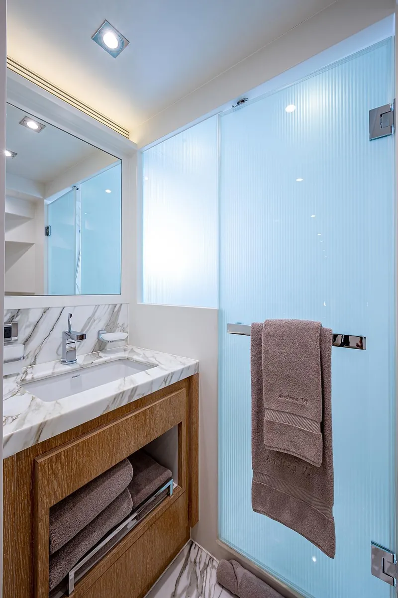 Slide: The Image of Luxurious bathroom in 2014 Horizon RP 110 yacht with marble sink and glass shower. - 26