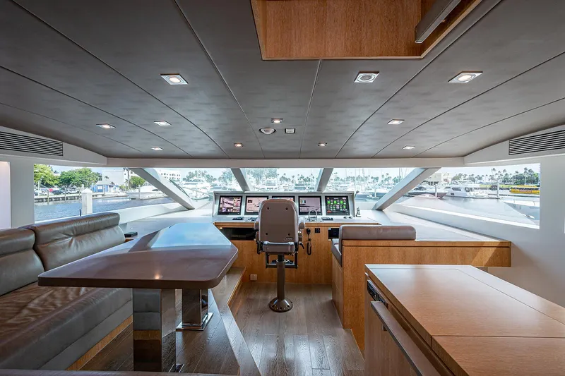 Slide: The Image of Luxurious interior of 2014 Horizon RP 110 yacht with modern helm and seating area. - 27