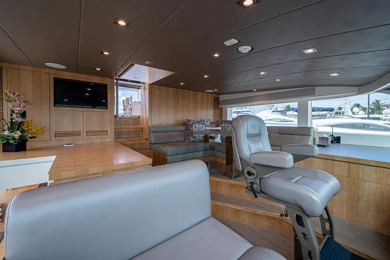 Slide: The Image of Luxurious interior of 2014 Horizon RP 110 yacht with modern seating and entertainment area. - 31