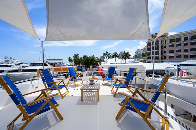Slide: The Image of Luxury yacht deck with blue chairs, Horizon RP 110, 2014 model, marina view. - 40