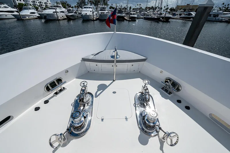 Slide: The Image of Bow of 2014 Horizon RP 110 yacht with polished winches, docked in marina. - 45