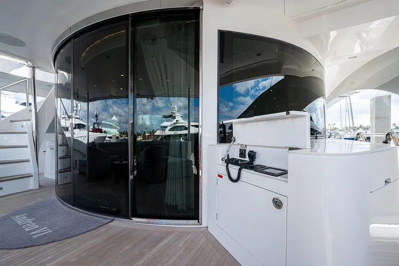 Slide: The Image of Luxurious Horizon RP 110 yacht deck with sleek glass doors and modern amenities, 2014 model. - 49