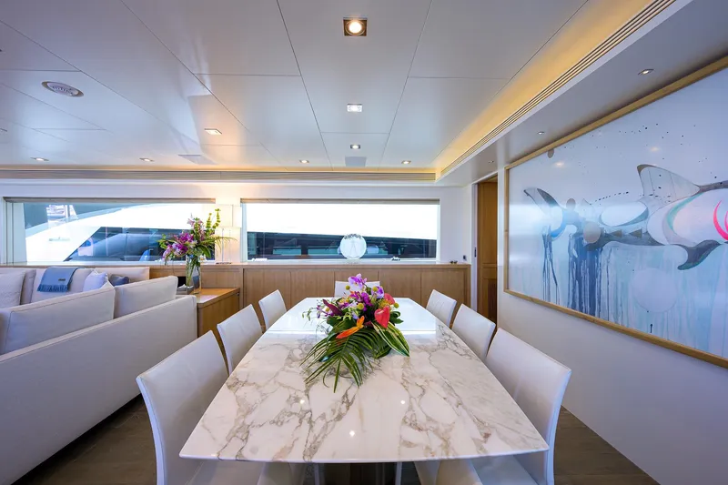 Slide: The Image of Luxurious dining area on 2014 Horizon RP 110 yacht with marble table and elegant decor. - 7