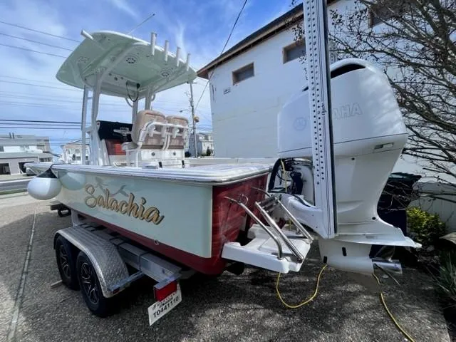 Slide: The Image of 2019 Sportsman Masters 247 Bay Boat on trailer, featuring Yamaha outboard motor. - 26