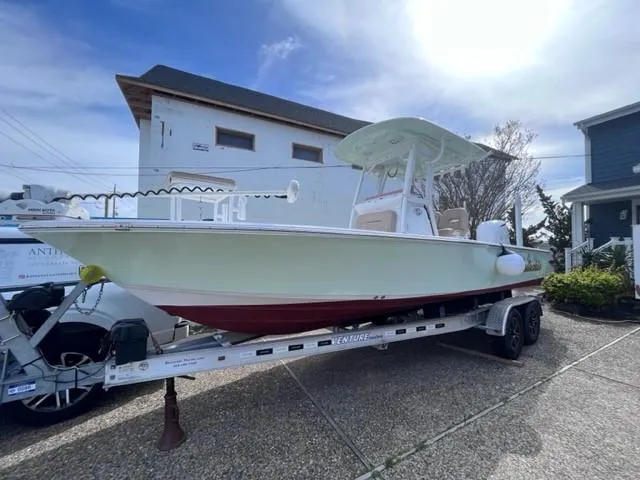 Slide: The Image of 2019 Sportsman Masters 247 Bay Boat on trailer, parked outdoors. - 4
