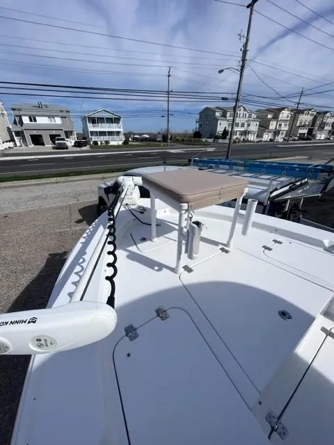Slide: The Image of 2019 Sportsman Masters 247 Bay Boat on trailer, coastal background, clear sky. - 6