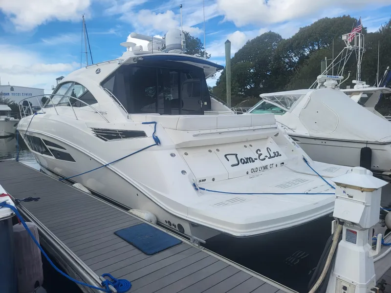 Slide: The Image of 2013 Sea Ray 510 Sundancer yacht docked at marina under blue sky. - 17