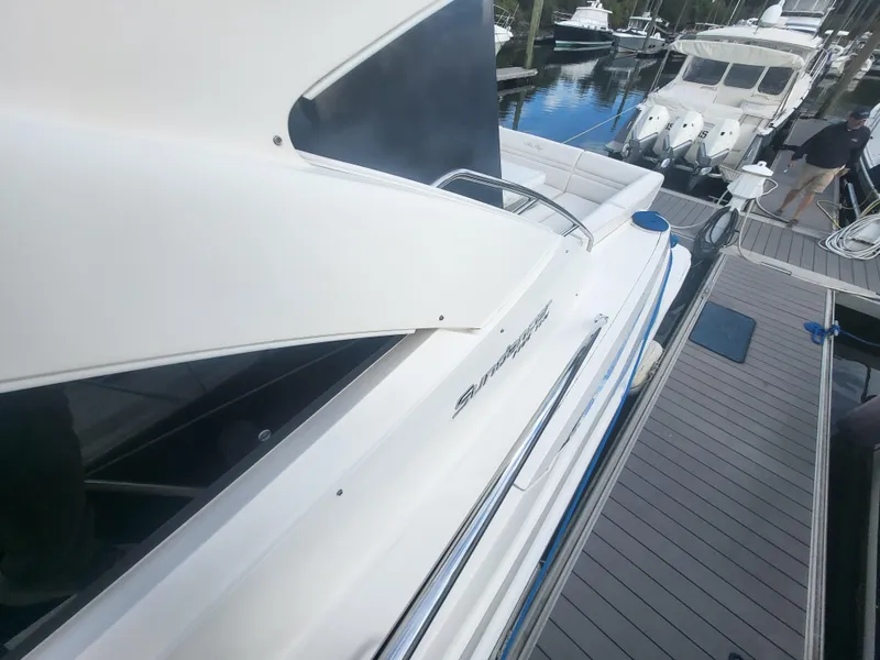 Slide: The Image of 2013 Sea Ray 510 Sundancer yacht docked at marina, side view. - 18