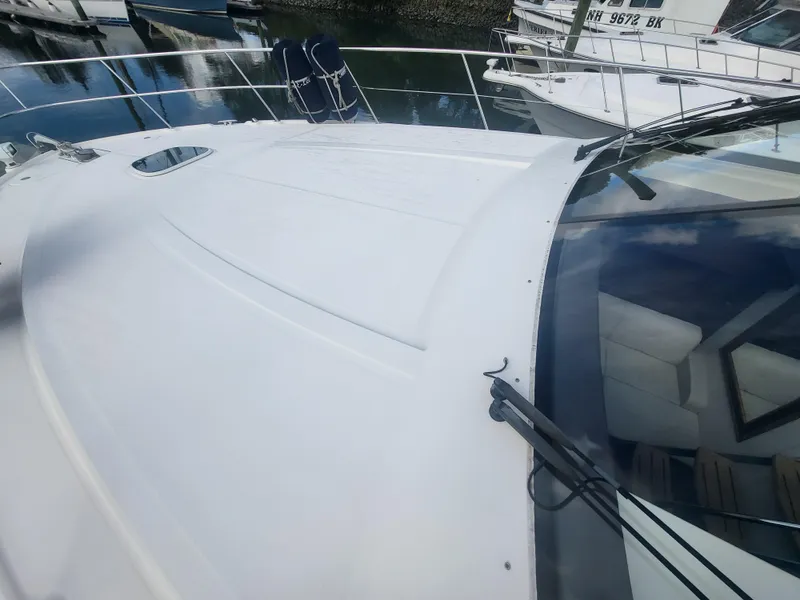 Slide: The Image of 2013 Sea Ray 510 Sundancer yacht deck, featuring sleek design and spacious layout. - 22