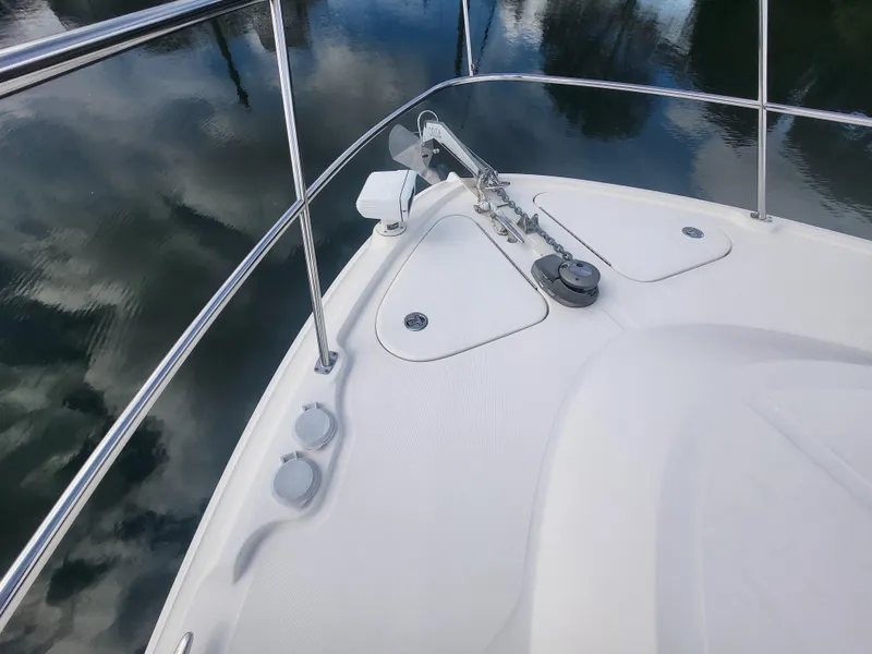 Slide: The Image of 2013 Sea Ray 510 Sundancer bow with stainless steel railings and anchor. - 27