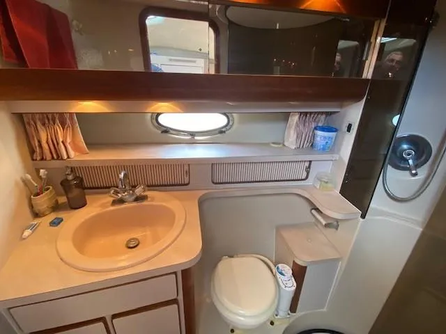 Slide: The Image of 1992 Regal 40 Commodore yacht bathroom with sink, toilet, and shower. - 20