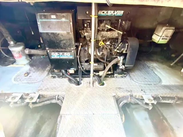 Slide: The Image of Engine room of a 1992 Regal 40 Commodore boat with Quicksilver generator. - 24