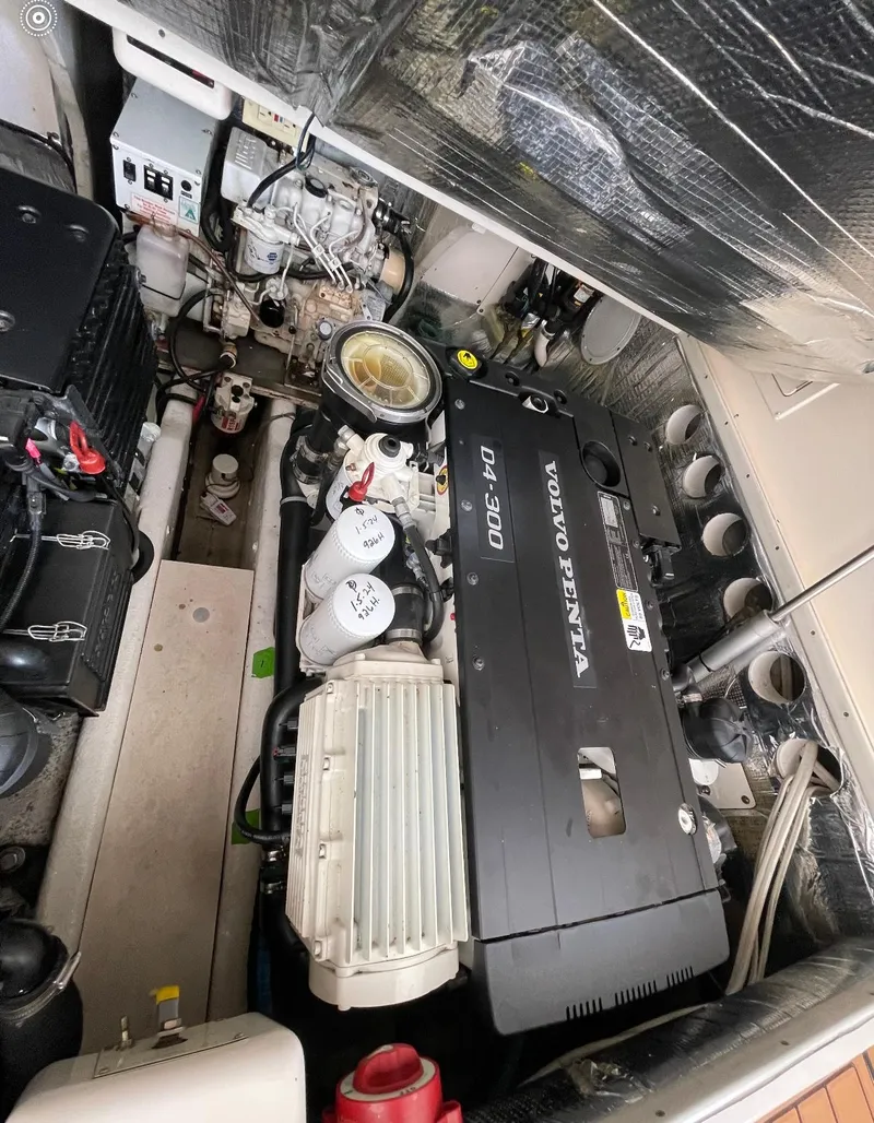 Slide: The Image of Engine compartment of a 2006 Carolina Classic 28 Express with Volvo Penta D4-300 engine. - 21