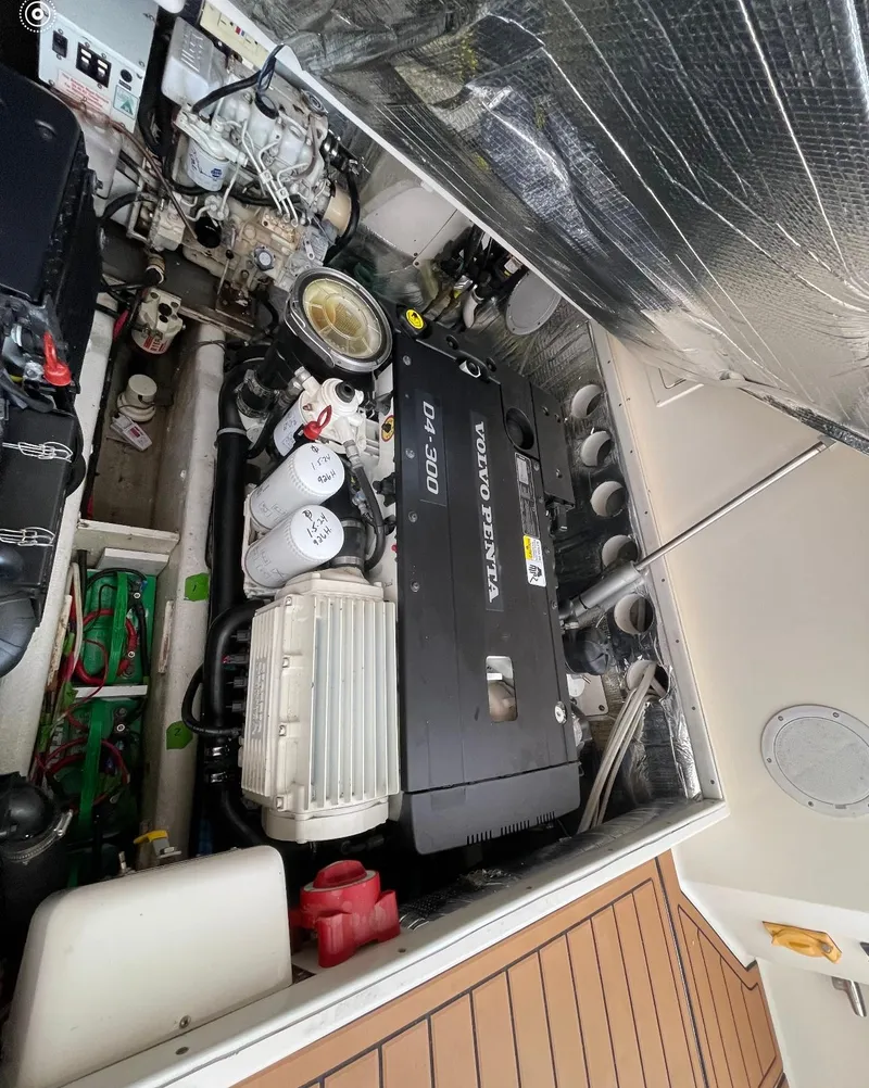 Slide: The Image of Engine compartment of a 2006 Carolina Classic 28 Express with Volvo Penta D4-300 engine. - 22