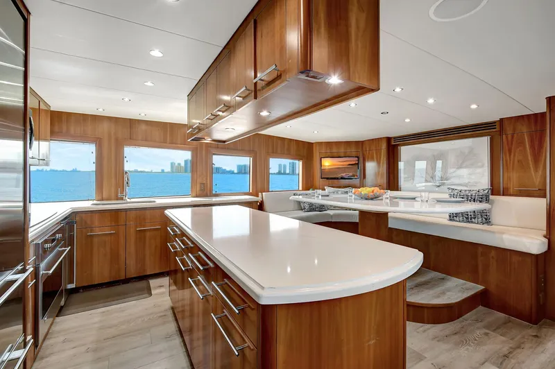 Slide: The Image of Luxurious 2005 Hatteras Semi-Displacement yacht interior with modern kitchen and panoramic windows. - 11