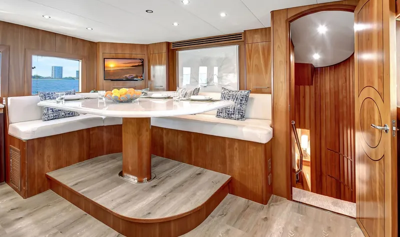 Slide: The Image of Luxurious 2005 Hatteras Semi-Displacement yacht interior with elegant dining area and modern decor. - 15
