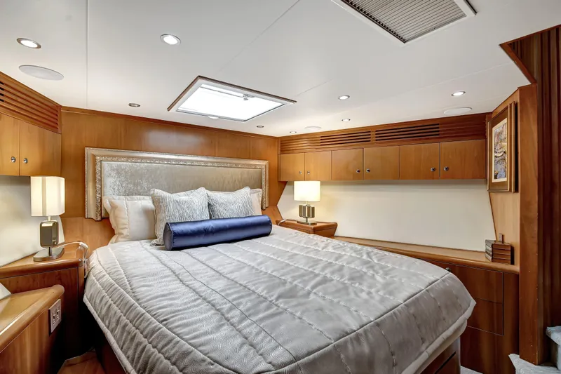 Slide: The Image of Luxurious bedroom interior of 2005 Hatteras Semi-Displacement yacht with elegant wood finishes. - 27