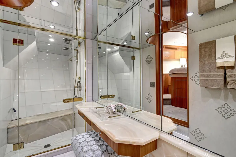 Slide: The Image of Luxurious bathroom in 2005 Hatteras Semi-Displacement yacht with elegant fixtures and mirrored walls. - 29