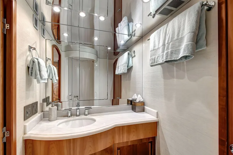 Slide: The Image of Luxurious bathroom in 2005 Hatteras Semi-Displacement yacht with modern fixtures and elegant design. - 32