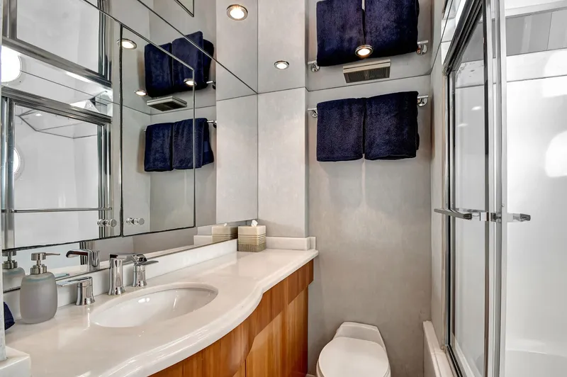 Slide: The Image of Luxurious bathroom in 2005 Hatteras Semi-Displacement yacht with modern fixtures and elegant design. - 34