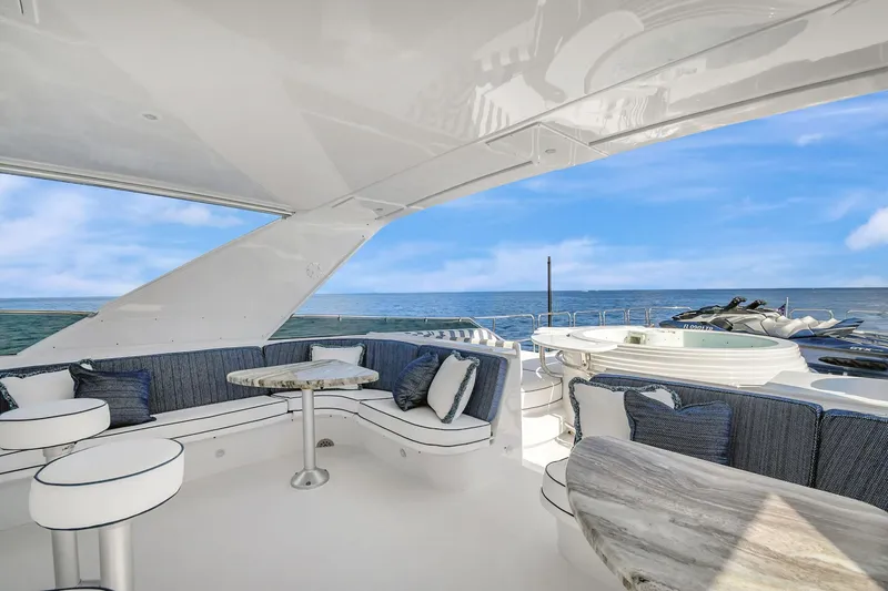 Slide: The Image of Luxurious 2005 Hatteras Semi-Displacement yacht with elegant seating and ocean view. - 43