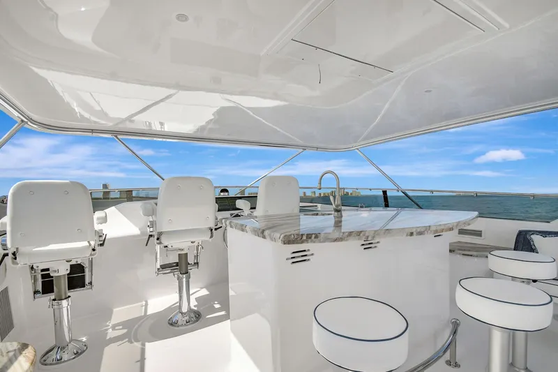 Slide: The Image of Luxurious 2005 Hatteras Semi-Displacement yacht interior with modern seating and ocean view. - 44