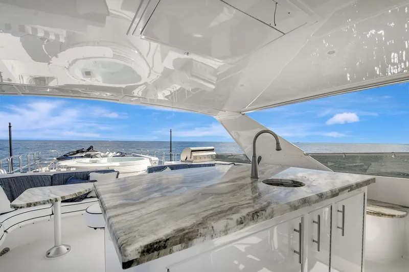 Slide: The Image of Luxurious 2005 Hatteras Semi-Displacement yacht with elegant outdoor bar and ocean view. - 47