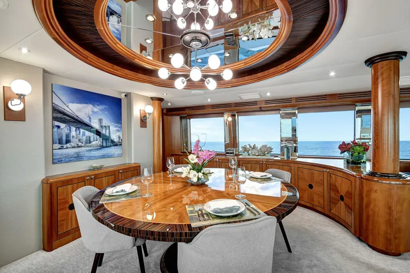 Slide: The Image of Luxurious dining area on 2005 Hatteras Semi-Displacement yacht with ocean view and elegant decor. - 8