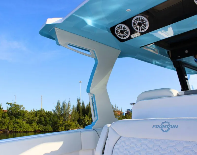 Slide: The Image of 2025 Fountain 38 SCX boat interior with sleek design and modern audio system. - 11