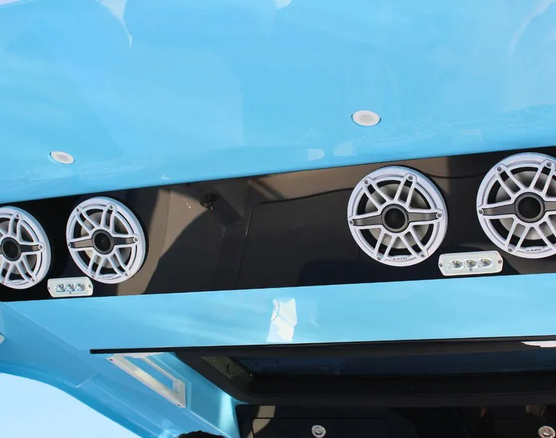 Slide: The Image of 2025 Fountain 38 SCX boat speakers and lights on blue interior. - 12