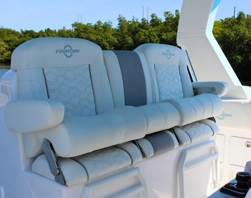 Slide: The Image of 2025 Fountain 38 SCX boat seats with white upholstery and armrests. - 13